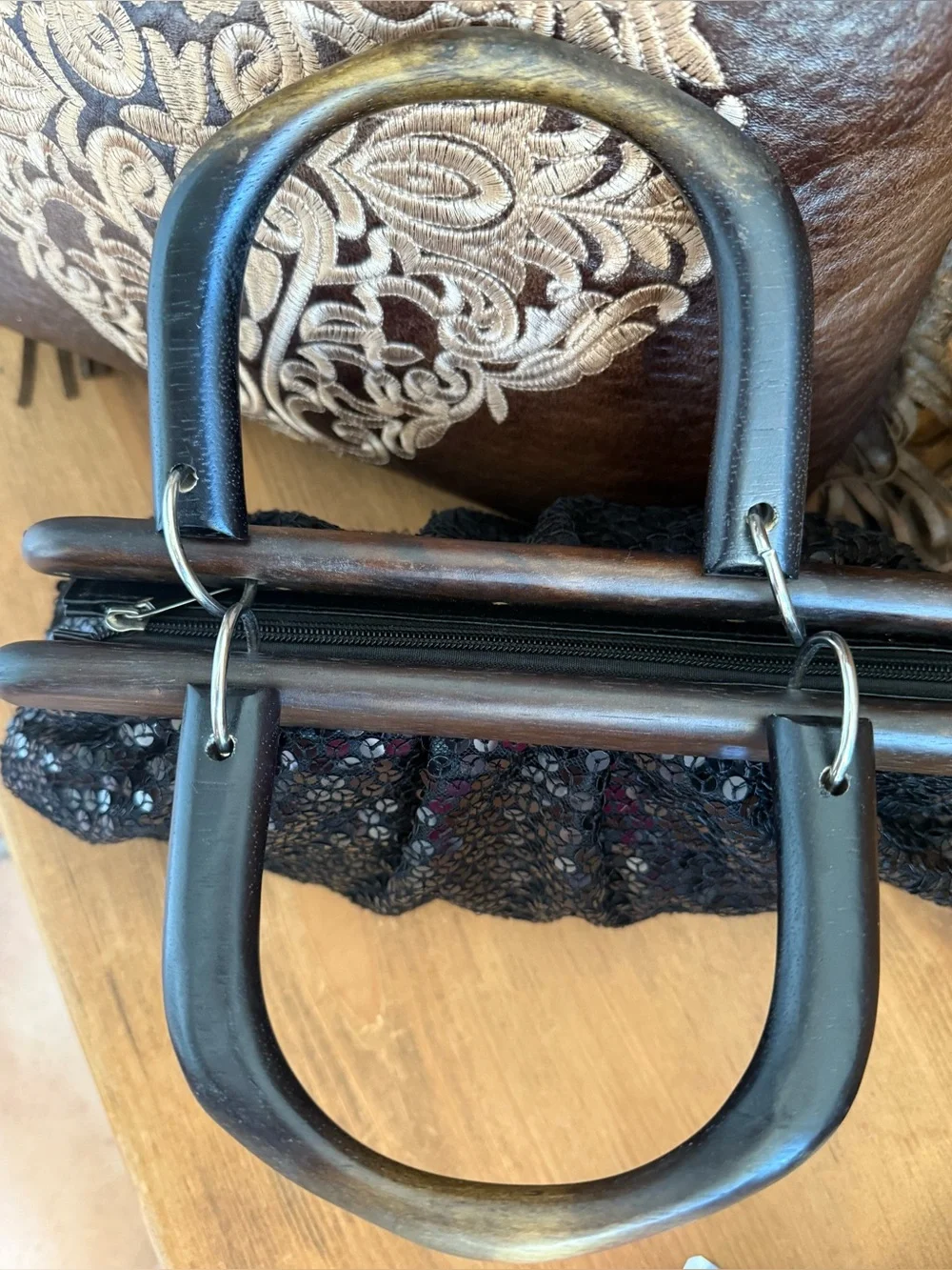 Vintage black sequin handbag with wood trim and handles.